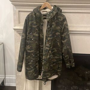 Volcom Camo jacket lined with terry inner liner.3/4 length. Size L. Never worn.